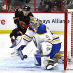 
              Buffalo Sabres goaltender Craig Anderson (41) makes a save as Ottawa Senators left wing Tim Stutzle looks on, during the second period of an NHL hockey game in Ottawa, Ontario, Sunday, Jan. 1, 2023. (Justin Tang/The Canadian Press via AP)
            