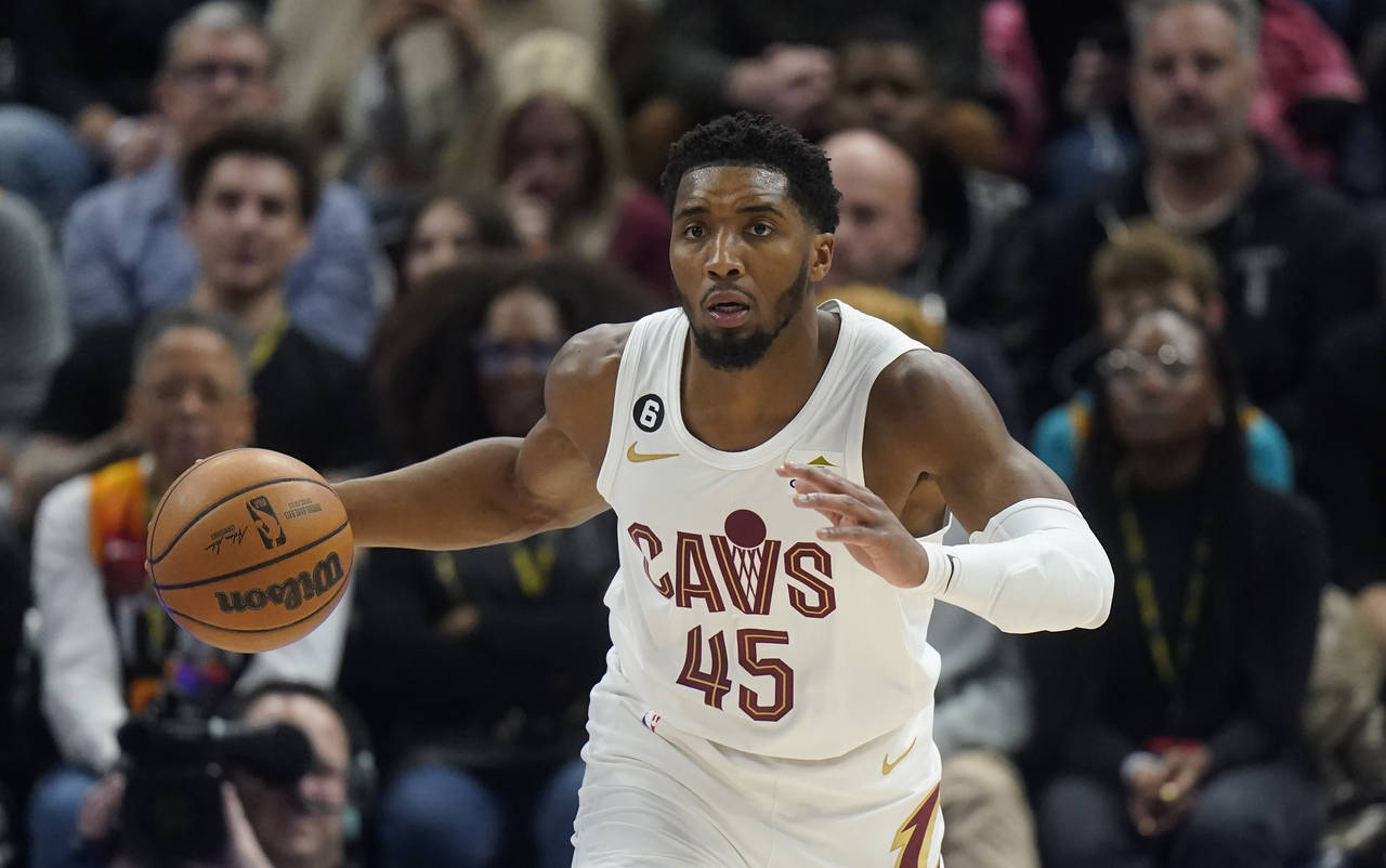 Cleveland Cavaliers guard Donovan Mitchell (45) brings the ball up during the first half of the tea...