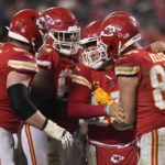 
              Kansas City Chiefs quarterback Patrick Mahomes (15) is helped by teammates after a play against the Jacksonville Jaguars during the second half of an NFL divisional round playoff football game, Saturday, Jan. 21, 2023, in Kansas City, Mo. (AP Photo/Jeff Roberson)
            