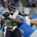 
              Chicago Bears quarterback Justin Fields (1) is sacked during the second half of an NFL football game against the Detroit Lions, Sunday, Jan. 1, 2023, in Detroit. (AP Photo/Paul Sancya)
            