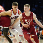 
              Arizona's Pelle Larsson, third from right, gets caught in a pick as Washington State's Justin Powell (24) drives to the basket during the first half of an NCAA college basketball game, Saturday, Jan. 7, 2023, in Tucson, Ariz. (AP Photo/Darryl Webb)
            