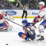 
              New York Islanders right wing Hudson Fasching (20) falls on the ice skating against Montreal Canadiens defenseman Justin Barron (52) during the second period of an NHL hockey game, Saturday, Jan. 14, 2023, in Elmont, N.Y. (AP Photo/Mary Altaffer)
            