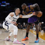 
              Memphis Grizzlies forward Dillon Brooks (24) defends against Los Angeles Lakers forward LeBron James (6) during the second half of an NBA basketball game in Los Angeles, Friday, Jan. 20, 2023. (AP Photo/Ashley Landis)
            