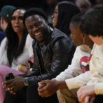 
              Comedian Kevin Hart sits in the front row during the first half of an NBA basketball game between the Memphis Grizzlies and the Los Angeles Lakers in Los Angeles, Friday, Jan. 20, 2023. (AP Photo/Ashley Landis)
            