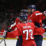 
              Washington Capitals left wing Alex Ovechkin, right, celebrates his goal against the Pittsburgh Penguins with defenseman Dmitry Orlov (9) and left wing Conor Sheary (73) during the first period of an NHL hockey game Thursday, Jan. 26, 2023, in Washington. (AP Photo/Nick Wass)
            