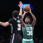 
              Boston Celtics guard Marcus Smart (36) shoots as Brooklyn Nets guard Seth Curry (30) defends during the first half of an NBA basketball game Thursday, Jan. 12, 2023, in New York. (AP Photo/Mary Altaffer)
            