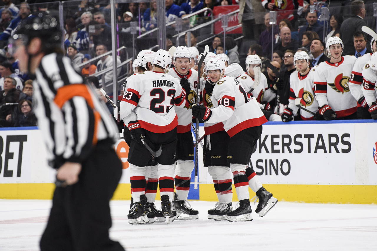 Ottawa Senators forward Brady Tkachuk (7) celebrates with teammates after scoring against the Toron...