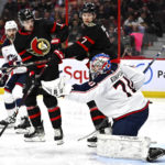
              Columbus Blue Jackets goaltender Joonas Korpisalo (70) makes a glove save in front of Ottawa Senators left wing Brady Tkachuk (7) and right wing Drake Batherson (19) during the second period of an NHL hockey game, Tuesday, Jan. 3, 2023 in Ottawa, Ontario. (Justin Tang/The Canadian Press via AP)
            
