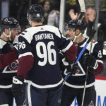 
              Colorado Avalanche left wing Matt Nieto, back right, is congratulated by left wing J.T. Compher, back left, and right wing Mikko Rantanen after scoring an empty-net goal late in the third period of an NHL hockey game the St. Louis Blues, Saturday, Jan. 28, 2023, in Denver. (AP Photo/David Zalubowski)
            