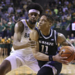 
              Kansas State forward Keyontae Johnson (11) drives to the basket against Baylor forward Flo Thamba, left, in the first half of an NCAA college basketball game, Saturday, Jan. 7, 2023, in Waco, Texas. (AP Photo/Rod Aydelotte)
            