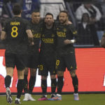 
              PSG's Lionel Messi celebrates after scoring his side's first goal with his teammates PSG's Neymar, right, and Kylian Mbappe during a friendly soccer match against a combined XI of Saudi Arabian teams Al Nassr and Al Hilal at the King Saud University Stadium, in Riyadh, Saudi Arabia, Thursday, Jan. 19, 2023. (AP Photo/Hussein Malla)
            