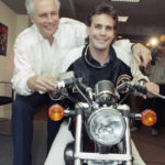 
              FILE - Motorcycle daredevil Robbie Knievel, right, poses with his famous father, Evel Kneivel, at a New York news conference on March 27, 1989. Robbie Knievel, an American stunt performer, died early Friday at a hospice in Reno, Nev., with his daughters at his side, his brother Kelly Knievel said. He was 60. Evel Knievel died in 2007. (AP Photo/Marty Lederhandler, File)
            