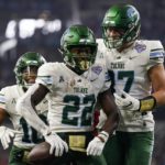
              Tulane running back Tyjae Spears (22) celebrates after scoring a touchdown during the first half of the Cotton Bowl NCAA college football game against Southern California, Monday, Jan. 2, 2023, in Arlington, Texas. (AP Photo/Sam Hodde)
            