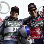 
              FILE - Bode Miller of the United States, right, winner of the Men's Downhil, poses next to second placed fellow countryman Daron Rahlves,l at the World Alpine Ski Championships, in Bormio, Italy, Saturday, Feb. 5, 2005. Mikaela Shiffrin's record 83rd World Cup victory Tuesday, Jan. 24, 2023 is only the latest exploit by an American team that has been producing success after success on the circuit since Daron Rahlves and Bode Miller started it all off more than 20 years ago. (AP Photo/Luca Bruno, File)
            