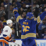 
              Buffalo Sabres defenseman Rasmus Dahlin (26) reacts after his assist on a goal by Alex Tuch during the second period of the team's NHL hockey game against the New York Islanders on Thursday, Jan. 19, 2023, in Buffalo, N.Y. (AP Photo/Joshua Bessex)
            