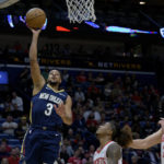 
              New Orleans Pelicans guard CJ McCollum (3) shoots against the Houston Rockets during the first half of an NBA basketball game in New Orleans, Wednesday, Jan. 4, 2023. (AP Photo/Matthew Hinton)
            