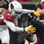 
              Arizona Cardinals linebacker Myjai Sanders (41) hits Atlanta Falcons quarterback Desmond Ridder (4) during the first half of an NFL football game, Sunday, Jan. 1, 2023, in Atlanta. (AP Photo/John Bazemore)
            