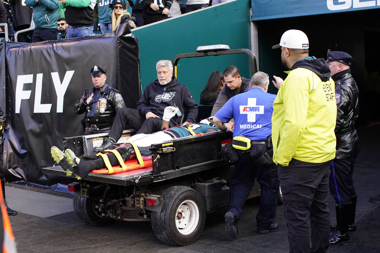 Philadelphia Eagles defensive end Josh Sweat is carted off the field after being injured in the fir...