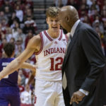 
              Indiana forward Miller Kopp (12) reacts toward head coach Mike Woodson during a break in the first half an NCAA college basketball game against Northwestern, Sunday, Jan. 8, 2023, in Bloomington, Ind. (AP Photo/Doug McSchooler)
            