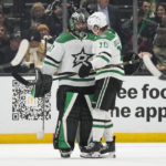 
              Dallas Stars goaltender Scott Wedgewood (41) and center Ty Dellandrea (10) celebrate a 4-0 win over the Los Angeles Kings in an NHL hockey game Thursday, Jan. 19, 2023, in Los Angeles. (AP Photo/Ashley Landis)
            