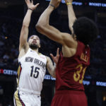 
              New Orleans Pelicans guard Jose Alvarado (15) shoots against Cleveland Cavaliers center Jarrett Allen (31) during the first half of an NBA basketball game, Monday, Jan. 16, 2023, in Cleveland. (AP Photo/Ron Schwane)
            