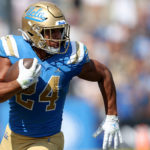 UCLA's Zach Charbonnet runs the ball during against Utah at the Rose Bowl on Oct. 8, 2022. (Sean M. Haffey/Getty Images)