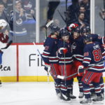 
              Winnipeg Jets' Adam Lowry (17), Neal Pionk (4), Mason Appleton (22), Blake Wheeler (26) and Nate Schmidt (88) celebrate Appleton's goal against the Colorado Avalanche during the first period of an NHL hockey game Friday, Feb. 24, 2023, in Winnipeg, Manitoba. (John Woods/The Canadian Press via AP)
            