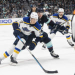 
              FILE -  St. Louis Blues defenseman Niko Mikkola, left, works against Seattle Kraken defenseman Vince Dunn during the third period of an NHL hockey game Tuesday, Dec. 20, 2022, in Seattle. The New York Rangers have acquired Vladimir Tarasenko and depth defenseman Niko Mikkola from the Blues, in a deal that sent conditional 2023 first- and 2024 fourth-round picks, forward Sammy Blais and prospect Hunter Skinner to St. Louis.(AP Photo/Stephen Brashear, File)
            