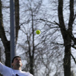 
              Serbian tennis player Novak Djokovic returns the ball during his open practise session in Belgrade, Serbia, Wednesday, Feb. 22, 2023. Djokovic said Wednesday he still hopes US border authorities would allow him entry to take part in two ATP Masters tennis tournaments despite being unvaccinated against the coronavirus. (AP Photo/Darko Vojinovic)
            