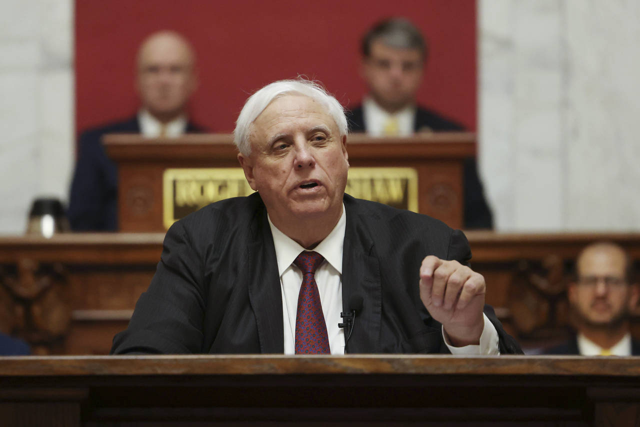 FILE - West Virginia Gov. Jim Justice delivers his annual State of the State address in the House C...