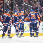 
              Edmonton Oilers' Evan Bouchard (2), Philip Broberg (86), Connor McDavid (97), Leon Draisaitl (29) and Zach Hyman (18) celebrate after a goal against the Boston Bruins during first-period NHL hockey game action in Edmonton, Alberta, Monday, Feb. 27, 2023. (Jason Franson/The Canadian Press via AP)
            