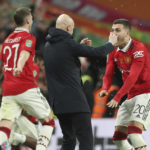 
              Manchester United's head coach Erik ten Hag, centre, Manchester United's Diogo Dalot, right, and Manchester United's Wout Weghorst celebrate after winning the English League Cup final soccer match between Manchester United and Newcastle United at Wembley Stadium in London, Sunday, Feb. 26, 2023. Manchester United won 2-0. (AP Photo/Scott Heppell)
            