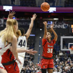 
              St. John's Kadaja Bailey (30) makes a 3-point basket in the first half of an NCAA college basketball game against UConn, Tuesday, Feb. 21, 2023, in Hartford, Conn. (AP Photo/Jessica Hill)
            
