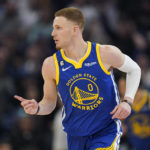 
              Golden State Warriors forward Donte DiVincenzo reacts after scoring against the Houston Rockets during the first half of an NBA basketball game in San Francisco, Friday, Feb. 24, 2023. (AP Photo/Godofredo A. Vásquez)
            