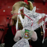 
              A Wrexham supporter holds a home made trophy before the FA Cup 4th round soccer match between Sheffield United and Wrexham at the Bramall Lane stadium in Sheffield, England, Tuesday, Feb. 7, 2023. (AP Photo/Jon Super)
            