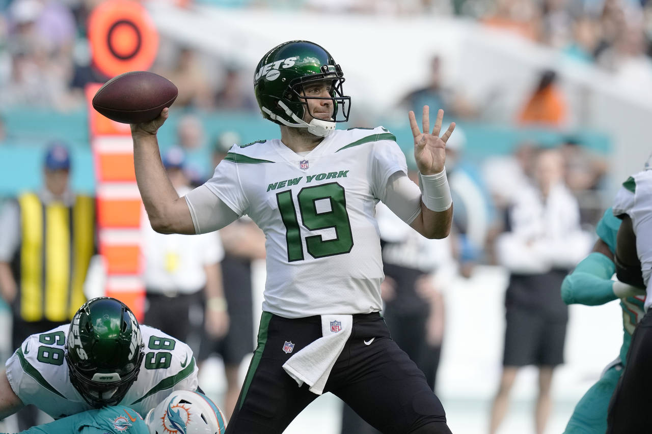 New York Jets quarterback Joe Flacco (19) aims a pass during the first half of an NFL football game...