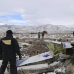
              This photo provided by The National Transportation Safety Board shows NTSB investigators on Sunday, Feb. 26, 2023, at the crash site in Dayton, Nev. documenting the wreckage of a Pilatus PC-12 airplane a medical air transport flight operated by Guardian Flight that crashed on Friday, Feb. 24, while enroute from Reno, Nevada, to Salt Lake City. (NTSB via AP)
            
