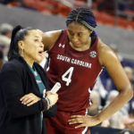 
              FILE -  South Carolina head coach Dawn Staley, left, talks with forward Aliyah Boston (4) during the second half of an NCAA college basketball game against Auburn, on Feb. 9, 2023, in Auburn, Ala. One thing's nearly certain when LSU's Angel Reese and South Carolina's Aliyah Boston face off Sunday in a showdown of the country's last two undefeated teams: Someone, if not both, will come away with a double-double. (AP Photo/Butch Dill, FIle)
            