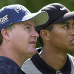 
              FILE - Bob May, of Las Vegas, Nev., left, along with with Tiger Woods, watches a tee shot fall on the seventh fairway during the National Car Rental Golf Classic at Walt Disney World in Lake Buena Vista, Fla., on Oct. 26, 2000. May was a journeyman from California who challenged Woods like no one else could in the summer of 2000. (AP Photo/Scott Audette, File)
            
