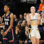 
              Marquette's Jordan King (23) claps in front of UConn's Aubrey Griffin (44) during the second half of an NCAA college basketball game Wednesday, Feb. 8, 2023, in Milwaukee. (AP Photo/Aaron Gash)
            