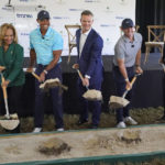 
              Golfers Tiger Woods, second from left, and Rory McIlroy, second from right, join others in breaking ground for the future home of a new tech-infused golf league, Tuesday, Feb. 21, 2023, on the campus of Palm Beach State College in Palm Beach Gardens, Fla. Others from left, Palm Beach State College President Ava Parker, TMRW Sports founder and CEO Mike McCarley, and PGA TOUR Commissioner Jay Monahan. (AP Photo/Wilfredo Lee)
            