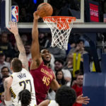 
              Cleveland Cavaliers guard Donovan Mitchell (45) tries to dunk but misses in front of Indiana Pacers center Daniel Theis (27) during the second half of an NBA basketball game in Indianapolis, Sunday, Feb. 5, 2023. (AP Photo/AJ Mast)
            