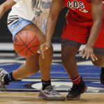 
              FILE - Two players vie for the ball during the first quarter of an FHSAA Class 4A state semifinal girls high school basketball game in Lakeland, Fla., on Feb. 28, 2018. Questions about female athletes’ menstrual history will no longer appear on the medical forms that Florida high school students have to fill out before participating in sports, though the new form will still ask athletes for their sex assigned at birth, rather than just their sex.  The Florida High School Athletic Association axed the questions on Thursday, Feb. 9, 2023, after listening to a flood of complaints contained in letters read aloud during an emergency meeting of the board.   (Octavio Jones/Tampa Bay Times via AP)
            