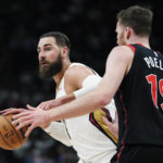 
              New Orleans Pelicans center Jonas Valanciunas (17) protects the ball from Toronto Raptors center Jakob Poeltl (19) during the first half of an NBA basketball game Thursday, Feb. 23, 2023, in Toronto. (Frank Gunn/The Canadian Press via AP)
            