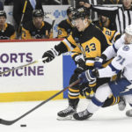 
              Pittsburgh Penguins left wing Danton Heinen (43) and Tampa Bay Lightning center Anthony Cirelli (71) battle for the puck during the second period of an NHL hockey game, Sunday, Feb. 26, 2023, in Pittsburgh. (AP Photo/Philip G. Pavely)
            
