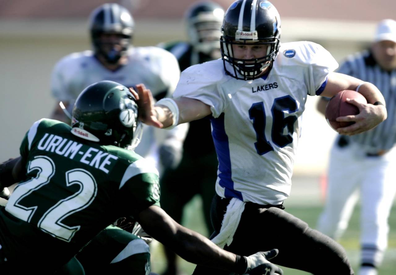 FILE - Grand Valley State quarterback Cullen Finnerty (16) holds off Northwest Missouri defender Ik...