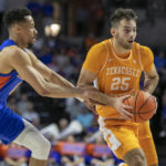 
              Florida guard Myreon Jones, left, pressures Tennessee guard Santiago Vescovi (25) during the first half of an NCAA college basketball game, Wednesday, Feb. 1, 2023, in Gainesville, Fla. (AP Photo/Alan Youngblood)
            
