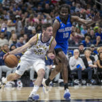 
              Indiana Pacers guard T.J. McConnell (9) drives against Orlando Magic center Bol Bol (10) during the first half of an NBA basketball game Saturday, Feb. 25, 2023, in Orlando, Fla. (AP Photo/Alan Youngblood)
            