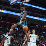 
              Detroit Pistons center Isaiah Stewart (28) dunks during the first half of an NBA basketball gameagainst the Charlotte Hornets, Friday, Feb. 3, 2023, in Detroit. (AP Photo/Carlos Osorio)
            