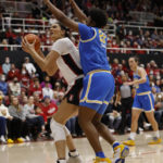 
              Stanford center Lauren Betts (51) drives to the basket against UCLA center Christeen Iwuala (22) during the first half of an NCAA college basketball game on Monday, Feb. 20, 2023, in Stanford, Calif. (AP Photo/Josie Lepe)
            